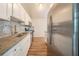 Stylish kitchen with stainless steel appliances, granite countertops, and gray subway tile backsplash at 6082 Raintree Bnd, Lithonia, GA 30058