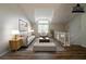 Bright and airy living room with vaulted ceiling, hardwood floors and large windows at 6082 Raintree Bnd, Lithonia, GA 30058