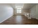 Bright living room with hardwood floors, high ceilings, and a large window at 6082 Raintree Bnd, Lithonia, GA 30058