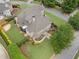 Aerial view of home, lush lawn, landscaped yard, patio, and driveway at 6263 Fernstone Nw Trl, Acworth, GA 30101