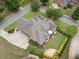 Overhead view of home, well-manicured lawn, landscaped yard, patio, and mature trees at 6263 Fernstone Nw Trl, Acworth, GA 30101