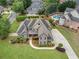 Aerial view of a stunning home with a pool, landscaping, and a long driveway at 6263 Fernstone Nw Trl, Acworth, GA 30101