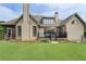 Spacious backyard with lush lawn and deck, perfect for outdoor gatherings at 6263 Fernstone Nw Trl, Acworth, GA 30101