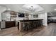 Finished basement with custom bar, brick accent wall, and comfortable seating at 6263 Fernstone Nw Trl, Acworth, GA 30101