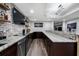Stylish basement bar featuring granite countertops, custom cabinets, and modern fixtures at 6263 Fernstone Nw Trl, Acworth, GA 30101