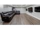 Large finished basement featuring hardwood floors and a comfortable seating area with multiple screens at 6263 Fernstone Nw Trl, Acworth, GA 30101