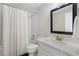 Bathroom with a shower-tub, white shower curtain, and a granite vanity at 6263 Fernstone Nw Trl, Acworth, GA 30101