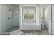 Beautiful white tiled bathroom with a large shower, soaking tub, and toilet room at 6263 Fernstone Nw Trl, Acworth, GA 30101