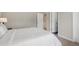 Comfortable Bedroom with a white comforter and multiple doors leading to other rooms at 6263 Fernstone Nw Trl, Acworth, GA 30101