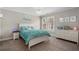 Bedroom with a Chandelier, comfortable bed, dresser, and decorated wall art at 6263 Fernstone Nw Trl, Acworth, GA 30101