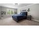 Charming bedroom with blue accents, a large window, and stylish decor at 6263 Fernstone Nw Trl, Acworth, GA 30101