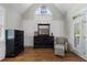 Charming sitting area in a bedroom with natural light, dark wood floors and dresser at 6263 Fernstone Nw Trl, Acworth, GA 30101