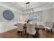 Elegant dining room with hardwood floors, stylish lighting, and decorative wall accents at 6263 Fernstone Nw Trl, Acworth, GA 30101