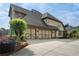 Spacious home with a three-car garage, stone accents, manicured landscaping and a long driveway at 6263 Fernstone Nw Trl, Acworth, GA 30101