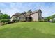Beautiful home with a sprawling green lawn and mature trees, offering a serene and inviting curb appeal at 6263 Fernstone Nw Trl, Acworth, GA 30101