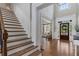 Grand foyer with staircase, high ceilings, and beautiful hardwood floors at 6263 Fernstone Nw Trl, Acworth, GA 30101