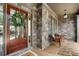 Close-up of a charming front porch, featuring stone accents and a cozy seating area at 6263 Fernstone Nw Trl, Acworth, GA 30101