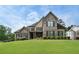 Beautiful two-story home featuring a manicured lawn and mature landscaping at 6263 Fernstone Nw Trl, Acworth, GA 30101