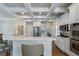 Spacious kitchen with white cabinets, stainless steel appliances and center island at 6263 Fernstone Nw Trl, Acworth, GA 30101