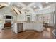 Open concept kitchen with large island, stainless steel appliances, and view to adjacent dining room at 6263 Fernstone Nw Trl, Acworth, GA 30101