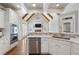 Gourmet kitchen with stainless appliances, stone backsplash, and views of the living area at 6263 Fernstone Nw Trl, Acworth, GA 30101