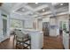 Bright kitchen with stainless appliances, island with breakfast bar and white cabinets at 6263 Fernstone Nw Trl, Acworth, GA 30101