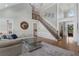 Spacious living room with hardwood floors, an elegant staircase, and lots of natural light at 6263 Fernstone Nw Trl, Acworth, GA 30101