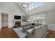 Cozy living room with fireplace, large windows, hardwood floors and comfortable seating at 6263 Fernstone Nw Trl, Acworth, GA 30101
