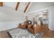Living room featuring hardwood floors, peaked ceiling, and views of the kitchen and breakfast nook at 6263 Fernstone Nw Trl, Acworth, GA 30101