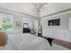 Spacious main bedroom with a tray ceiling, stylish decor, and serene ambiance for a restful retreat at 6263 Fernstone Nw Trl, Acworth, GA 30101