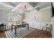 Well-lit office with coffered ceiling, large window, hardwood floors, and modern decor at 6263 Fernstone Nw Trl, Acworth, GA 30101