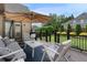 Outdoor patio with comfortable seating, umbrella, and backyard view at 6263 Fernstone Nw Trl, Acworth, GA 30101