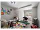 Colorful playroom with playful art and toys with a small table and chairs and striped rug at 6263 Fernstone Nw Trl, Acworth, GA 30101