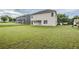 Large backyard with well-kept lawn, showcasing the home's exterior and the surrounding neighborhood at 8826 Lakecrest Way, Union City, GA 30291