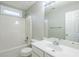 Bathroom with shower-tub combo, white vanity with sink and mirror, and modern fixtures at 8826 Lakecrest Way, Union City, GA 30291