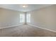 Bedroom with carpeted floors and lots of natural light at 8826 Lakecrest Way, Union City, GA 30291