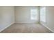 Bedroom featuring neutral paint, plush carpeting, and natural light at 8826 Lakecrest Way, Union City, GA 30291