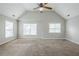 Spacious bedroom with high ceilings, a ceiling fan, and natural light from multiple windows at 8826 Lakecrest Way, Union City, GA 30291