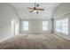 Spacious bedroom with a vaulted ceiling, fan, and multiple windows for ample natural light at 8826 Lakecrest Way, Union City, GA 30291