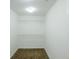 Walk-in closet with carpet and shelving in a neutral color palette at 8826 Lakecrest Way, Union City, GA 30291