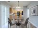 Cozy dining nook with a table, chairs, sliding doors, and an open view of the adjacent kitchen at 8826 Lakecrest Way, Union City, GA 30291