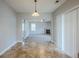 Bright dining area with sliding glass doors and a view into the living room with a fireplace at 8826 Lakecrest Way, Union City, GA 30291