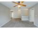Upstairs hallway features a ceiling fan and neutral paint, offering a comfortable and airy space at 8826 Lakecrest Way, Union City, GA 30291