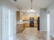Spacious kitchen with ample counter space, wooden cabinets, and a view into the breakfast nook at 8826 Lakecrest Way, Union City, GA 30291