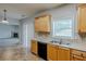 Open kitchen featuring stainless steel sink, black dishwasher, and bright window at 8826 Lakecrest Way, Union City, GA 30291