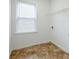Laundry room features vinyl flooring, a window, and wire shelving at 8826 Lakecrest Way, Union City, GA 30291