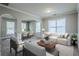 Open-concept living space features a smooth transition to the dining area, perfect for entertaining at 8826 Lakecrest Way, Union City, GA 30291