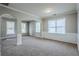 Bright living area boasts elegant trim work, arched doorways, and ample natural light from multiple windows at 8826 Lakecrest Way, Union City, GA 30291