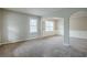 Spacious living area features elegant trim work, arched doorways, and neutral paint at 8826 Lakecrest Way, Union City, GA 30291