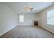 Spacious living area with a ceiling fan and fireplace at 8826 Lakecrest Way, Union City, GA 30291